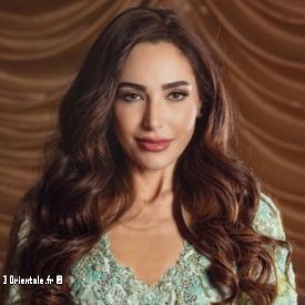 Abeer Nehme en robe vert clair